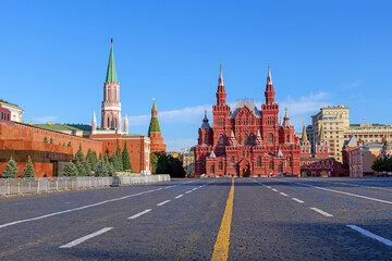 Red Square in Moscow, Russia, with the Kremlin walls and the State Historical Museum under a clear...