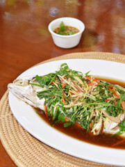 Steamed sea bass with soy sauce