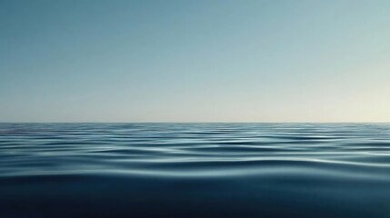 Abstract landscape background concept. Serene ocean view with smooth water surface under a clear blue sky.