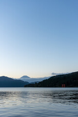 Mt. Fuji and red Torii gate on lake Ashi at Sunset, Hakone, Japan