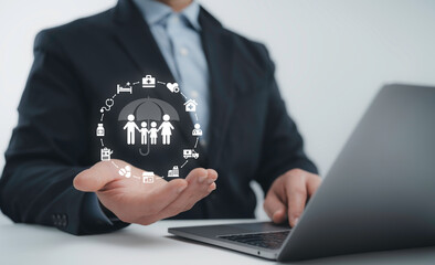 Businessman holding a digital insurance concept with a family protection icon, symbolizing...