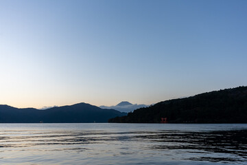 Mt. Fuji and red Torii gate on lake Ashi at Sunset, Hakone, Japan