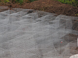 Gabion baskets for stone containment resist erosion and aging.