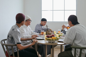 Happy Multi Generation Muslim Family Talking Together on Ramadan Moment