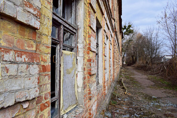old abandoned premises, ruin. empty territories, abandoned houses. concept of war, Chernobyl disaster, apocalypse. brick buildings. sad view, heavy atmosphere, old broken windows