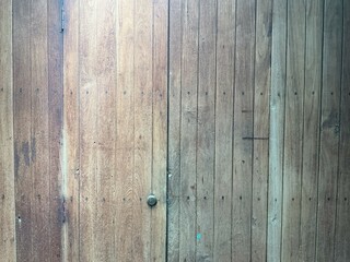 Weathered Wooden Door with Rustic Texture in Thailand