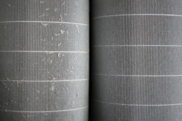 Fototapeta premium Dust on an air filter for use in an apartment when replacing. Close-up of a dirty and new clean filter.