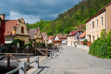 Traditional houses lining a charming street in Karlstejn, Czech Republic, creating an idyllic scene