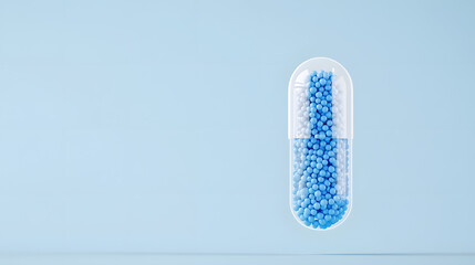 A blue and white capsule filled with small balls floating, symbolizing a futuristic concept of innovation, technology, or medical solutions. The floating capsule gives a sense of motion and modernity.