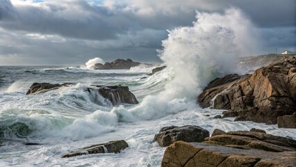 Obraz premium Powerful ocean waves crash dramatically against rugged coastal rocks, a breathtaking spectacle of natures untamed power and beauty.