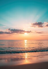 Fototapeta premium Close-up view of a sea sand beach with a panoramic tropical seascape. The horizon glows with an orange and golden sunset sky, radiating calmness and tranquility. Relaxing sunlight set