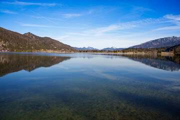 View over the calm waters of Lake Walchsee, Tyrol, Austria in spring