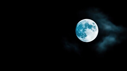 Obraz premium Dark sky concept. A luminous full moon shining brightly against a dark, cloudy night sky.