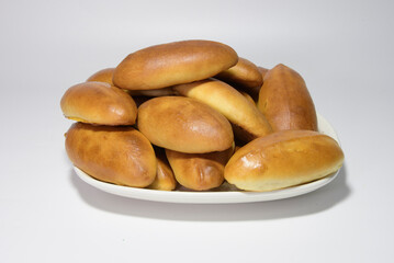 Homemade dough pies. On a white background, close-up