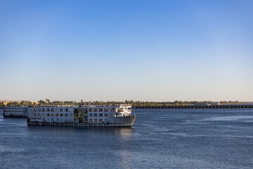 Panoramic view of Esna Lock on the Nile River, Egypt, showing the canal, dam, and traditional Nile cruise ships navigating through the lock system