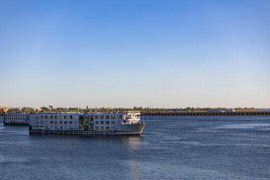 Panoramic view of Esna Lock on the Nile River, Egypt, showing the canal, dam, and traditional Nile cruise ships navigating through the lock system