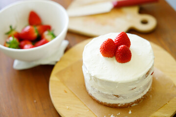 Homemade strawberry shortcake topped with fresh strawberries.