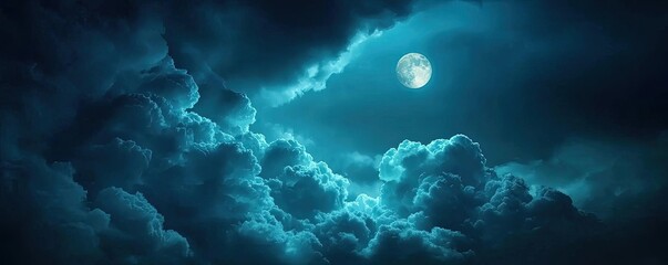 Fototapeta premium Dark sky concept. A serene view of a full moon illuminating dark, moody clouds in the night sky.