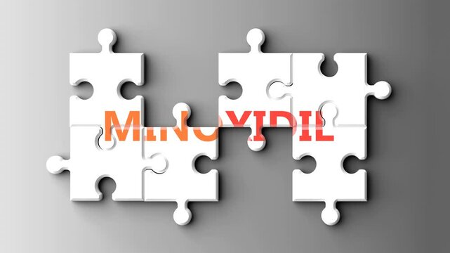 Minoxidil as a complex topic - pictured as word minoxidil on a puzzle pieces to show that minoxidil is a composite subject. Solving a puzzle. Pieces coming together to make a whole