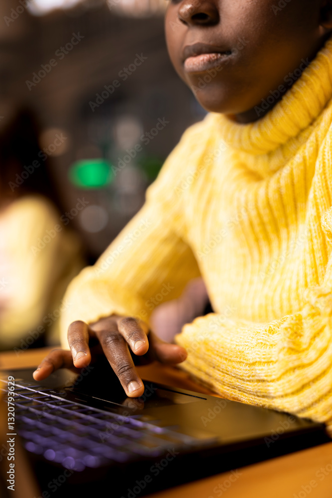 Poster Black scholar does research via internet and taking notes in a library, concentrating on theoretical studies and completing her class notes for the school assignment. Educational work. Close up.
