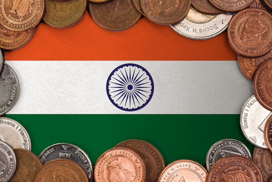 Coins on flag of India trading investment business currency concept