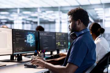 Artificial intelligence engineer in data center checks for performance issues arising due to high...