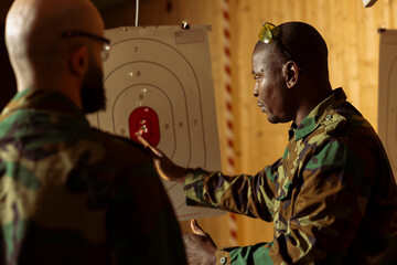 Military units at shooting range training necessary combat skills, hitting targets. Army special operations forces enhancing combat readiness by shooting bullseyes, testing precision