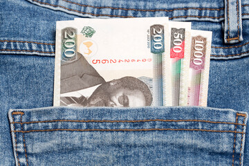 Kenyan shilling  in the pocket of blue jeans