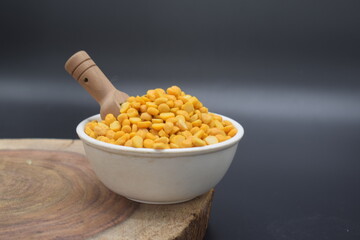 The pile of Gram pulses, Split Chickpeas, and Lentil Pulses. CHANA DAL OR SPLIT CHICKPEAS, Yellow split peas isolated on white background. Top view.