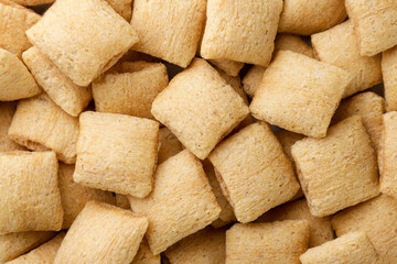 Crispy corn pads background. Top view