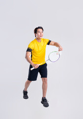 Portrait of Asian man playing badminton on white background.