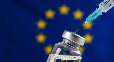 Syringe and vaccine bottle with the flag of the EU