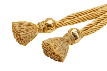 Tasseled curtain tiebacks in gold cord isolated on transparent white background