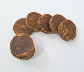 The palm sugar or Jaggery on white background	
