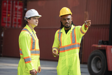 Engineer man Team in Safety Gear Control Containers Box at Container Cargo, Container Yard Workers...