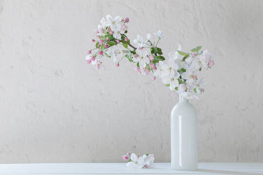 spring flowers in vase on white background