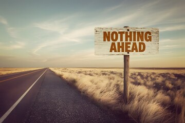 A long, desolate road stretching into the distance, marked by a sign that reads, Nothing Ahead, evoking a sense of solitude and mystery. 