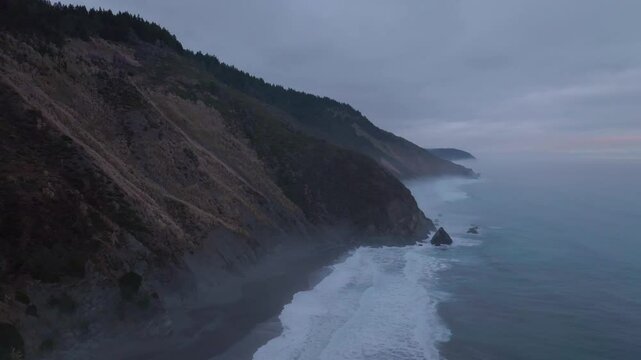 USAL Beach camping landscape scene Sinkyone Wilderness Lost Coast Trail California aerial drone rugged untouched coastline black sand Pacific Ocean mist sunset cloudy untouched waves crashing static