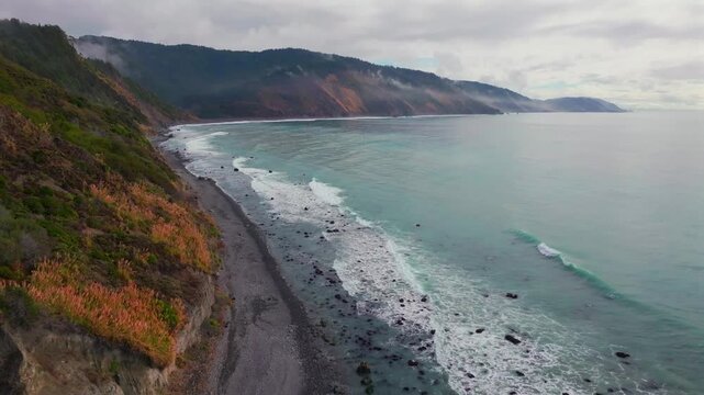 USAL Beach vibrant Pacific Ocean landscape scene Sinkyone Wilderness Lost Coast Trail California aerial drone rugged untouched coastline rain mist morning remote untouched waves crashing forward pan