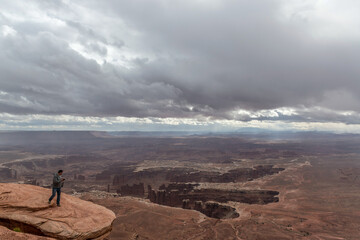 Man walking on the clif Canyonlands National Park 