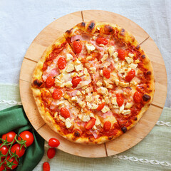 Top view of pizza with chikken, cheese, tomatoes, copy space, moc up