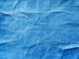 Obraz premium Crumpled Blue Fabric Texture Background with Highlighted Folds and Shadow