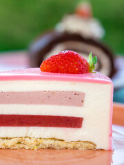 Slice of cake with a strawberry on top