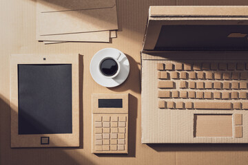 Business desktop with laptop made of cardboard
