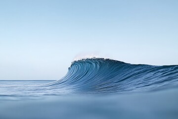 Majestic ocean wave rising with smooth, reflective surface under