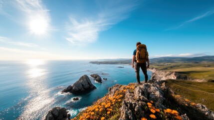 A traveler gazes out from a rocky viewpoint adorned with colorful flowers, capturing the serene beauty of the ocean and rugged coastline bathed in golden sunlight.