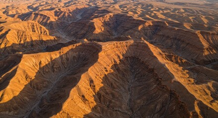 Aerial View of Dramatic Desert Landscape with Layered Mountains at Sunset