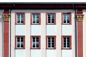 Naklejka premium background of historic white facade with windows in row, symbol for historic architecture