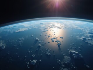 Fototapeta premium Sunlight reflecting on earth's atmosphere from space