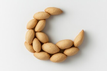 Obraz premium Creative Arrangement of Almond Cookies in a Crescent Shape on a White Background